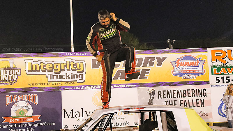 Jason Songer celebrates after winning the Diamond in the Rough USRA Hobby Stock feature.